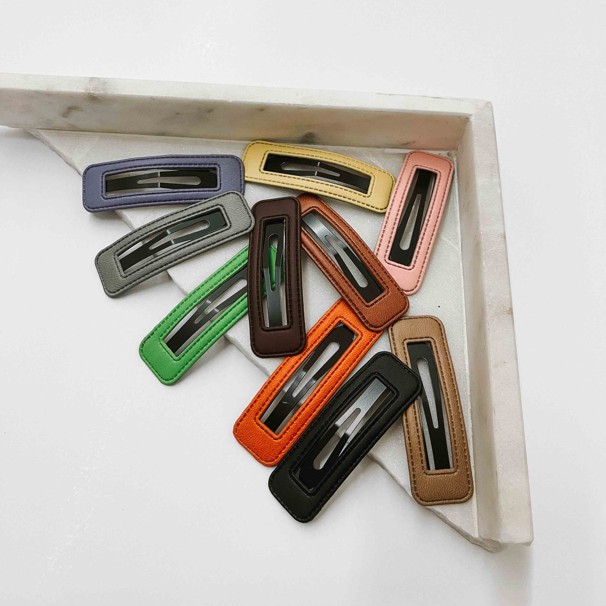 Leather hair clip sets in bright and neutral colors. Lightly Leathered Clip Set